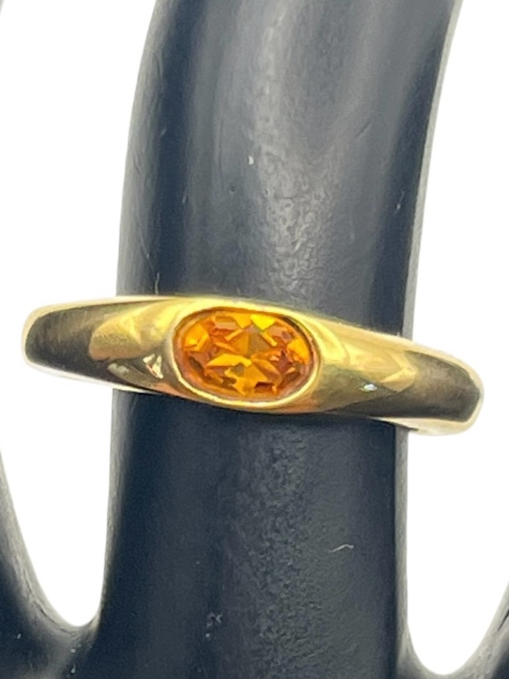 Orange oval stone gold tone flush set ring size 6.5